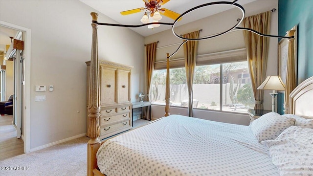 bedroom with baseboards, light carpet, and ceiling fan