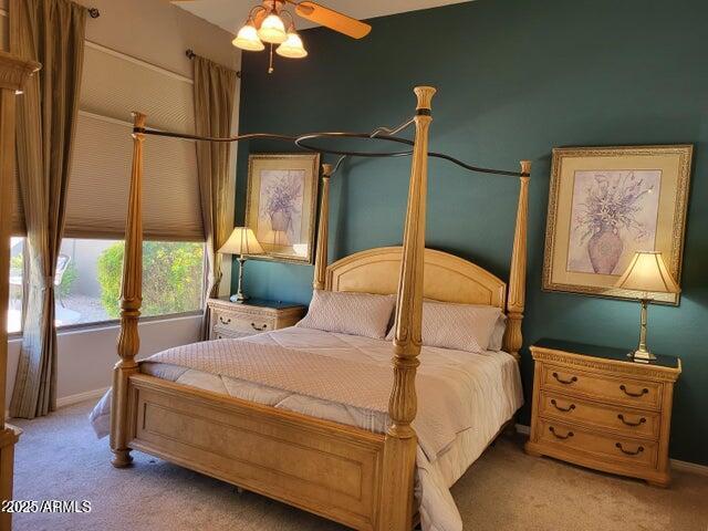 bedroom featuring carpet floors and baseboards