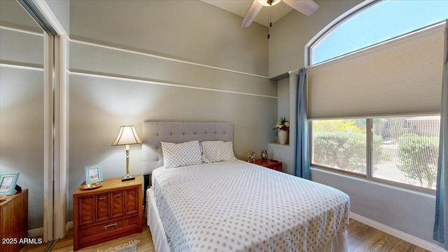 bedroom with baseboards and light wood-type flooring