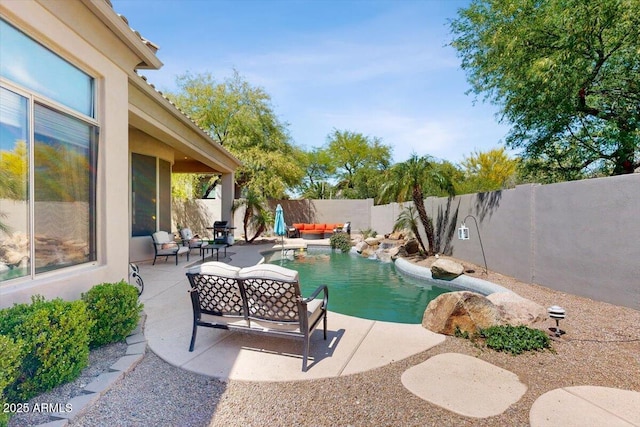 view of pool featuring a patio, an outdoor living space, a fenced backyard, and a fenced in pool