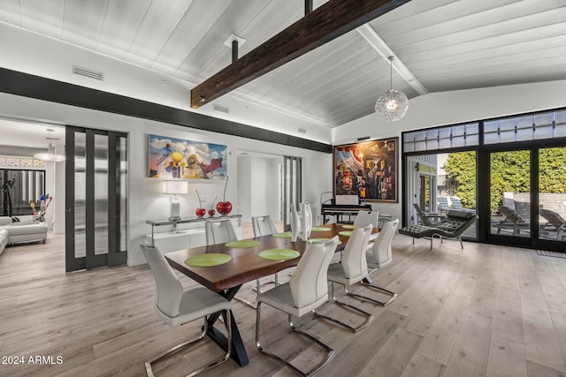 dining room with vaulted ceiling with beams, light hardwood / wood-style floors, and wooden ceiling