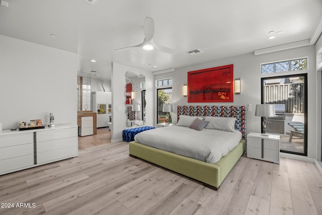 bedroom with ceiling fan and light hardwood / wood-style floors