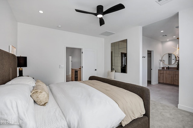 bedroom featuring ensuite bath and ceiling fan