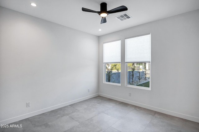 spare room with ceiling fan