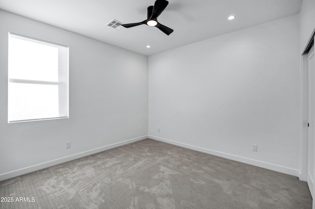 carpeted empty room with ceiling fan