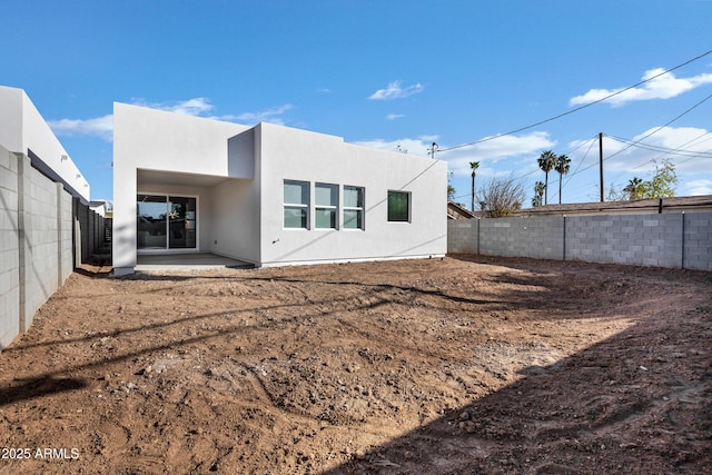 back of house with a patio area