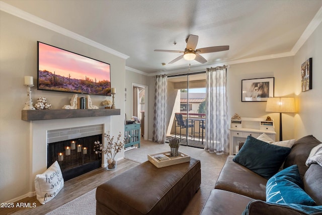 750 E Northern Ave Unit 2143, Phoenix, AZ 85020 - living room featuring ceiling fan, crown molding, a fireplace with flush hearth, baseboards, and wood finished floors