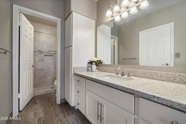 750 E Northern Ave Unit 2143, Phoenix, AZ 85020 - full bathroom with vanity, wood finished floors, toilet, and tiled shower
