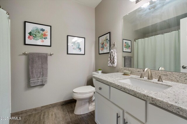 750 E Northern Ave Unit 2143, Phoenix, AZ 85020 - bathroom with toilet, wood finished floors, and vanity