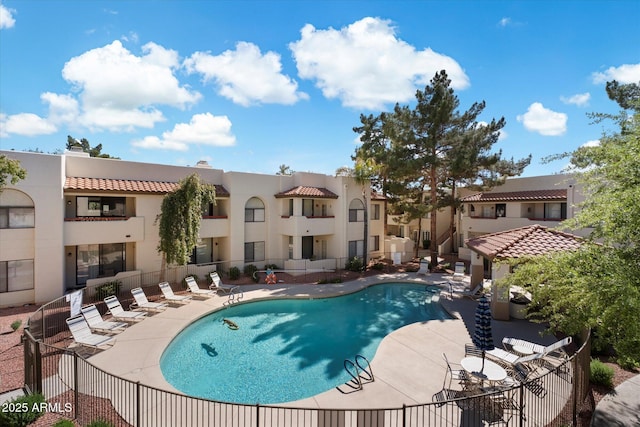 750 E Northern Ave Unit 2143, Phoenix, AZ 85020 - community pool with a patio, fence, and a residential view