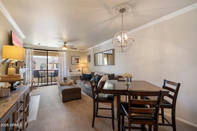 750 E Northern Ave Unit 2143, Phoenix, AZ 85020 - dining space with carpet flooring, crown molding, ceiling fan, a chandelier, and baseboards