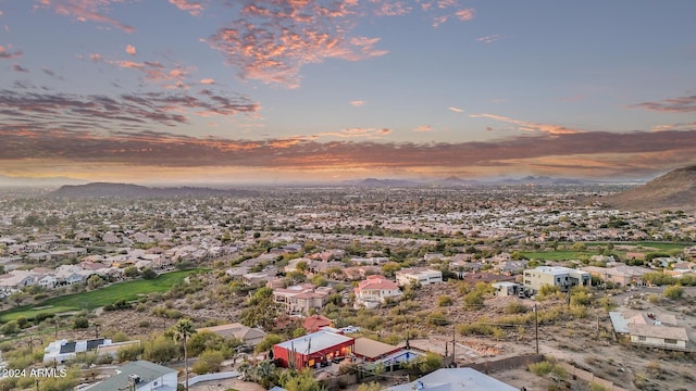 aerial view at dusk with a mountain view