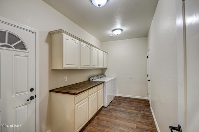 laundry room featuring cabinets, separate washer and dryer, and dark hardwood / wood-style floors