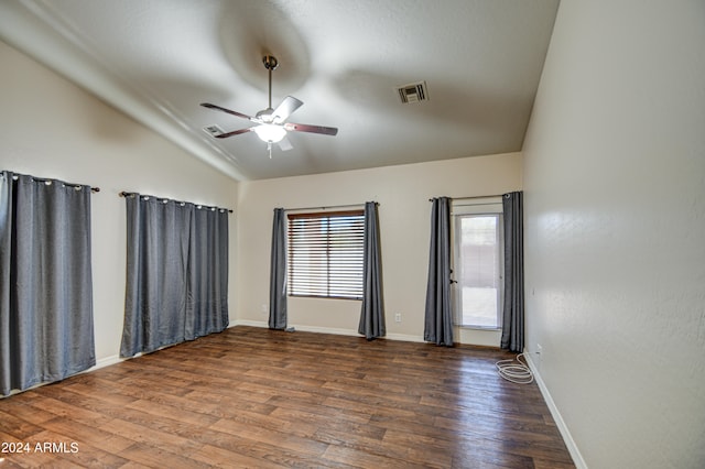 spare room with ceiling fan, hardwood / wood-style flooring, and vaulted ceiling