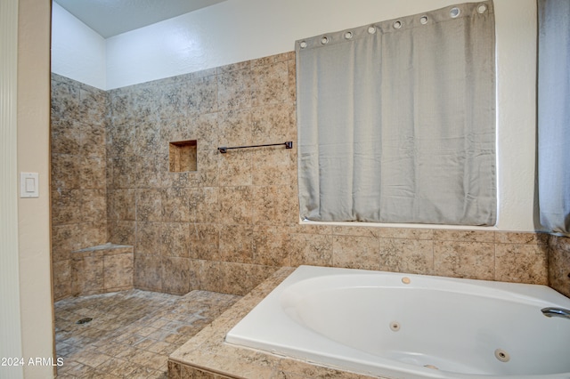 bathroom with tiled bath