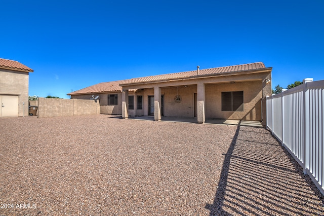 back of property featuring a patio