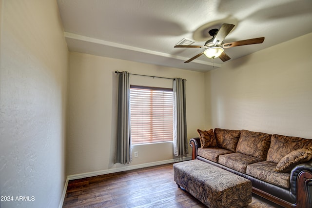 living room featuring hardwood / wood-style flooring and ceiling fan