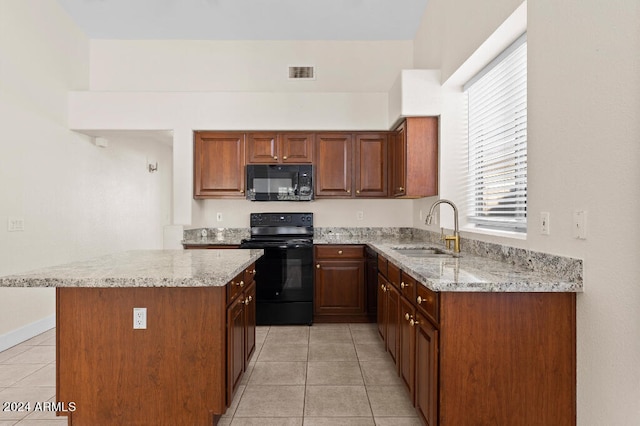 kitchen with light tile flooring, light stone counters, black appliances, and sink