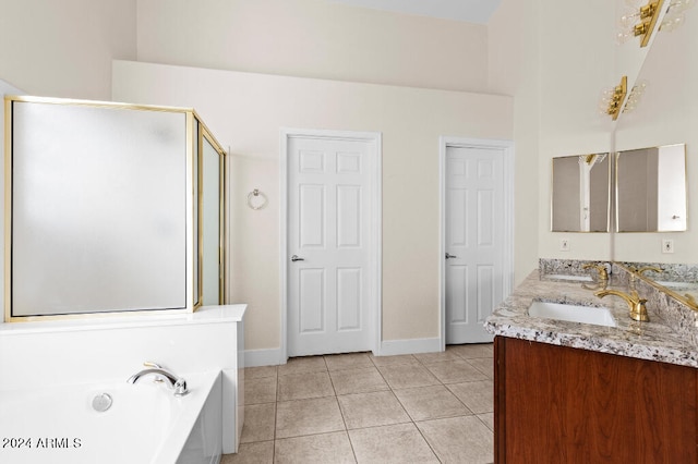 bathroom featuring tile flooring, dual sinks, shower with separate bathtub, and vanity with extensive cabinet space