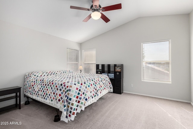 carpeted bedroom featuring lofted ceiling, ceiling fan, and baseboards