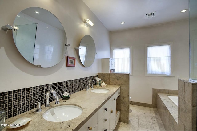 514 W Monte Vista Rd, Phoenix, AZ 85003 - full bath with double vanity, tile walls, toilet, tiled bath, and tile patterned floors