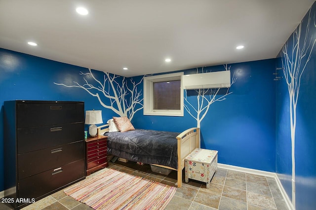 514 W Monte Vista Rd, Phoenix, AZ 85003 - bedroom featuring a wall unit AC, recessed lighting, baseboards, an accent wall, and stone finish flooring