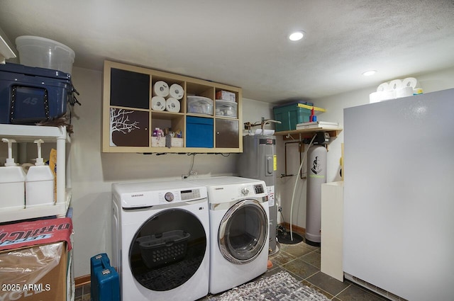 514 W Monte Vista Rd, Phoenix, AZ 85003 - laundry area featuring washer and clothes dryer, recessed lighting, electric water heater, and dark tile patterned flooring