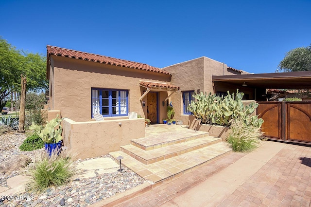514 W Monte Vista Rd, Phoenix, AZ 85003 - view of front of property with stucco siding and a tiled roof