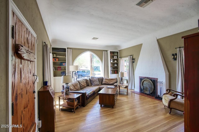 514 W Monte Vista Rd, Phoenix, AZ 85003 - living area featuring built in features and light wood finished floors