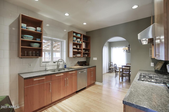 514 W Monte Vista Rd, Phoenix, AZ 85003 - kitchen featuring open shelves, appliances with stainless steel finishes, a sink, arched walkways, and light wood-type flooring