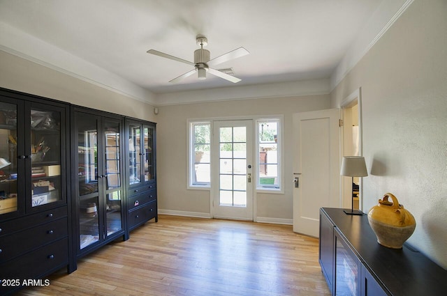 514 W Monte Vista Rd, Phoenix, AZ 85003 - doorway featuring ceiling fan, light wood-type flooring, and baseboards