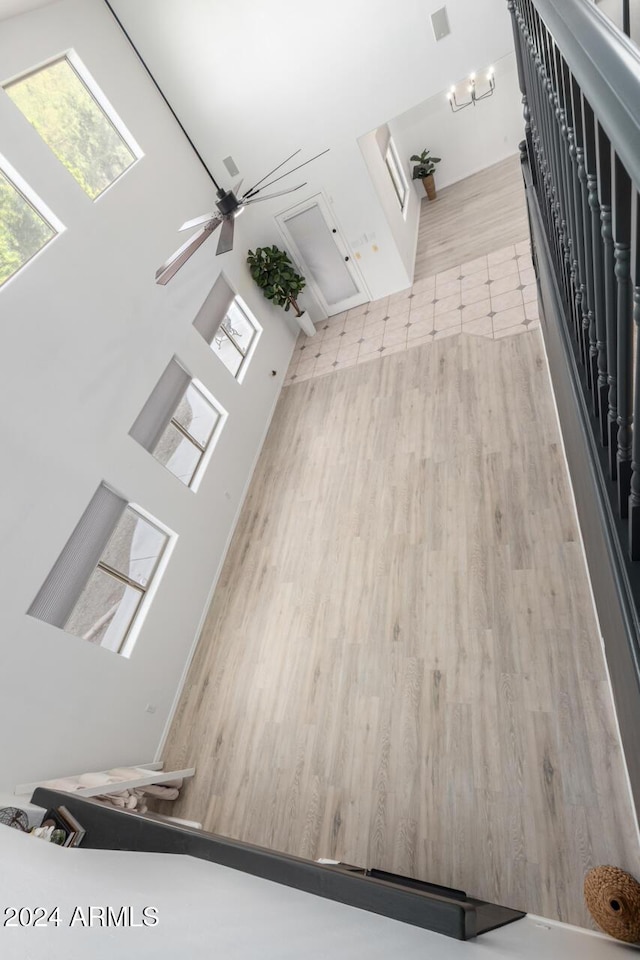 interior space with ceiling fan and wood finished floors