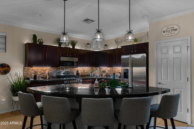 4200 E Narrowleaf Dr, Gilbert, AZ 85298 - kitchen featuring a kitchen bar, decorative backsplash, stainless steel appliances, and visible vents