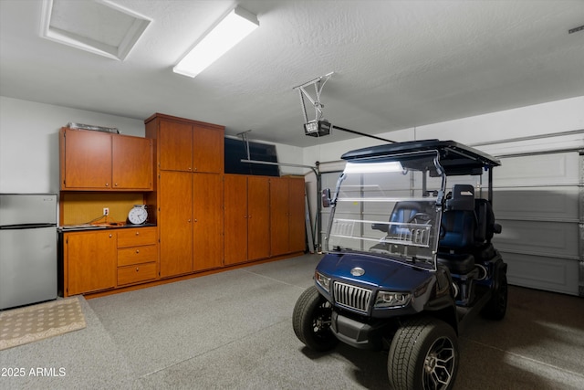 4200 E Narrowleaf Dr, Gilbert, AZ 85298 - garage featuring freestanding refrigerator and a garage door opener