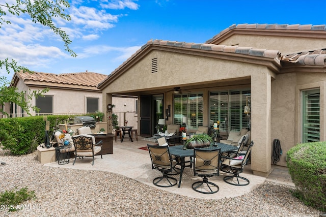 4200 E Narrowleaf Dr, Gilbert, AZ 85298 - back of property with a patio, a tiled roof, a ceiling fan, and stucco siding