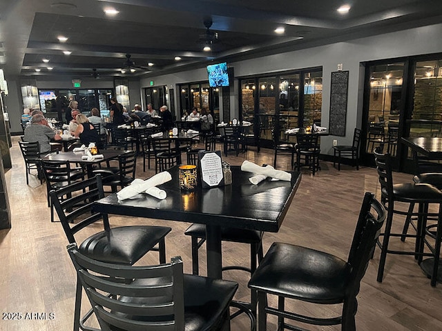 4200 E Narrowleaf Dr, Gilbert, AZ 85298 - dining space featuring wood finished floors, a ceiling fan, and a community bar