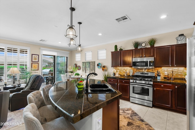 4200 E Narrowleaf Dr, Gilbert, AZ 85298 - kitchen with tasteful backsplash, visible vents, appliances with stainless steel finishes, and a sink