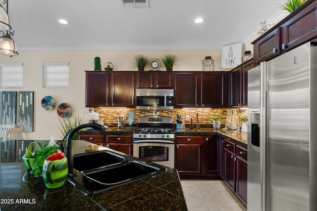 4200 E Narrowleaf Dr, Gilbert, AZ 85298 - kitchen featuring decorative backsplash, stainless steel appliances, tile counters, and a sink