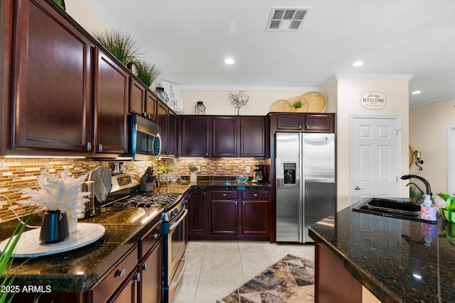 4200 E Narrowleaf Dr, Gilbert, AZ 85298 - kitchen featuring a sink, tasteful backsplash, visible vents, appliances with stainless steel finishes, and light tile patterned floors