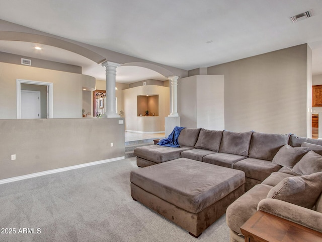 2724 W Fernwood Dr, Phoenix, AZ 85086 - living area featuring baseboards, visible vents, decorative columns, arched walkways, and carpet