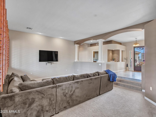 2724 W Fernwood Dr, Phoenix, AZ 85086 - living area featuring baseboards, carpet flooring, visible vents, ornate columns, and arched walkways