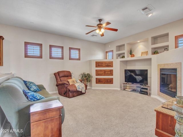 2724 W Fernwood Dr, Phoenix, AZ 85086 - living room featuring visible vents, baseboards, a ceiling fan, and carpet floors