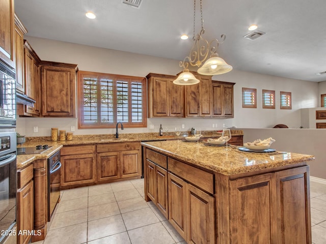 2724 W Fernwood Dr, Phoenix, AZ 85086 - kitchen featuring a sink, visible vents, and brown cabinets