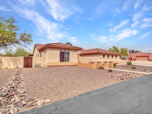 2724 W Fernwood Dr, Phoenix, AZ 85086 - view of front facade featuring a tiled roof, fence, and stucco siding