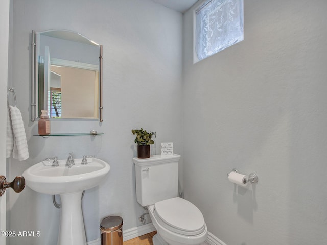 2724 W Fernwood Dr, Phoenix, AZ 85086 - bathroom with baseboards, a sink, and toilet