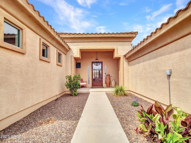 2724 W Fernwood Dr, Phoenix, AZ 85086 - view of exterior entry with stucco siding and a tiled roof