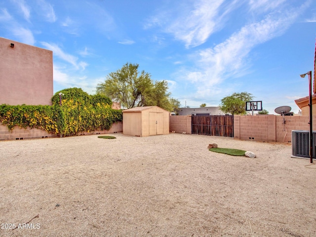 2724 W Fernwood Dr, Phoenix, AZ 85086 - view of yard with central air condition unit, a storage shed, a fenced backyard, and an outdoor structure