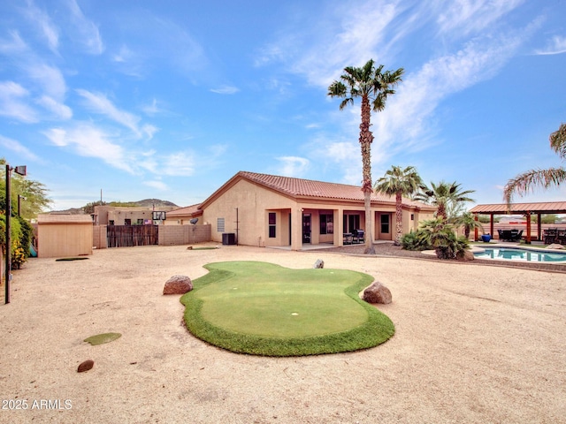 2724 W Fernwood Dr, Phoenix, AZ 85086 - rear view of house with stucco siding, a patio area, a tile roof, a gazebo, and a fenced in pool