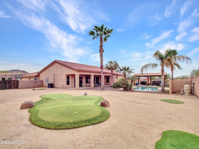 2724 W Fernwood Dr, Phoenix, AZ 85086 - back of house with a fenced in pool, a patio, stucco siding, cooling unit, and a tile roof