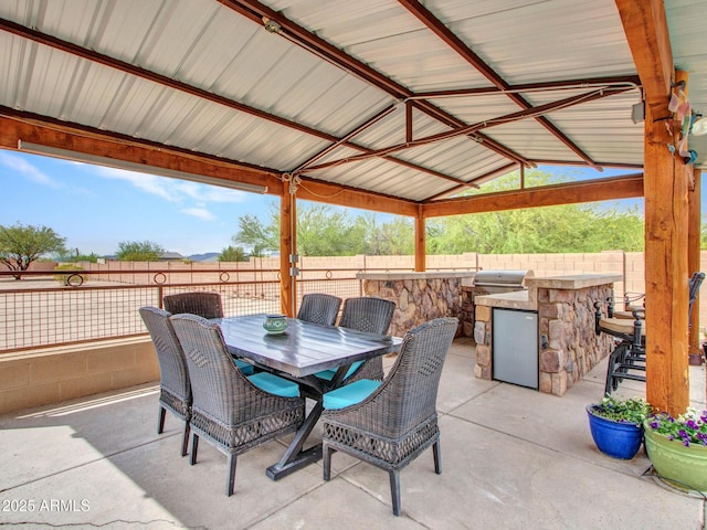 2724 W Fernwood Dr, Phoenix, AZ 85086 - view of patio with a gazebo, exterior kitchen, area for grilling, outdoor dining space, and fence